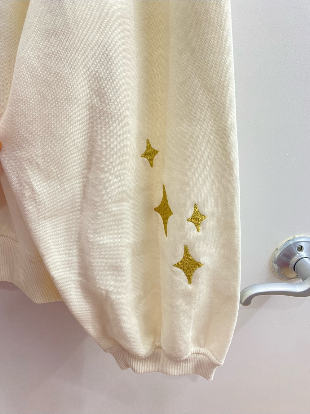 Wicked Movie Glittering Stars Cream Graphic Sweatshirt Size Medium Cozy - Picture 7 of 8